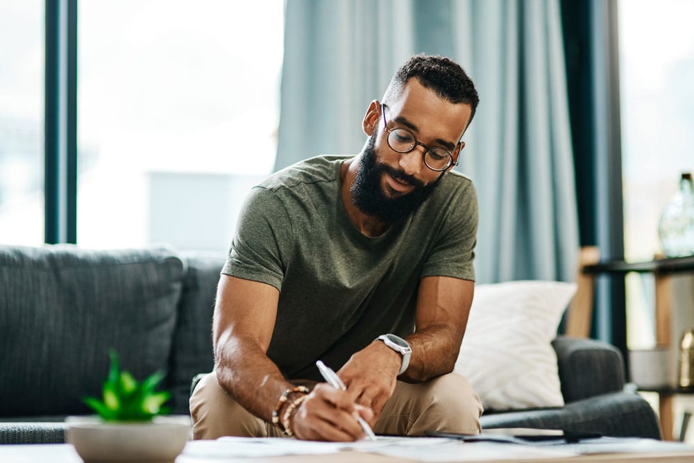 man filling out form for cds