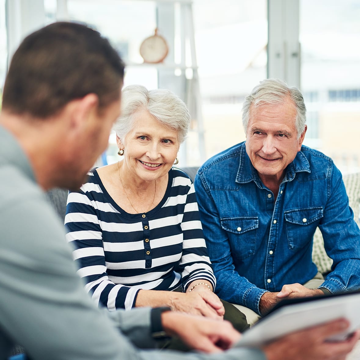 Shot of senior couple having a consultation with a financial advisor at home