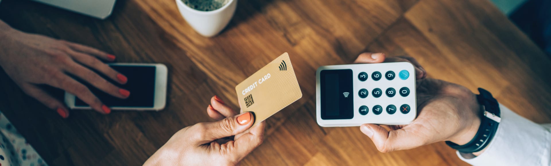 Contactless payment with credit card in cafeteria.